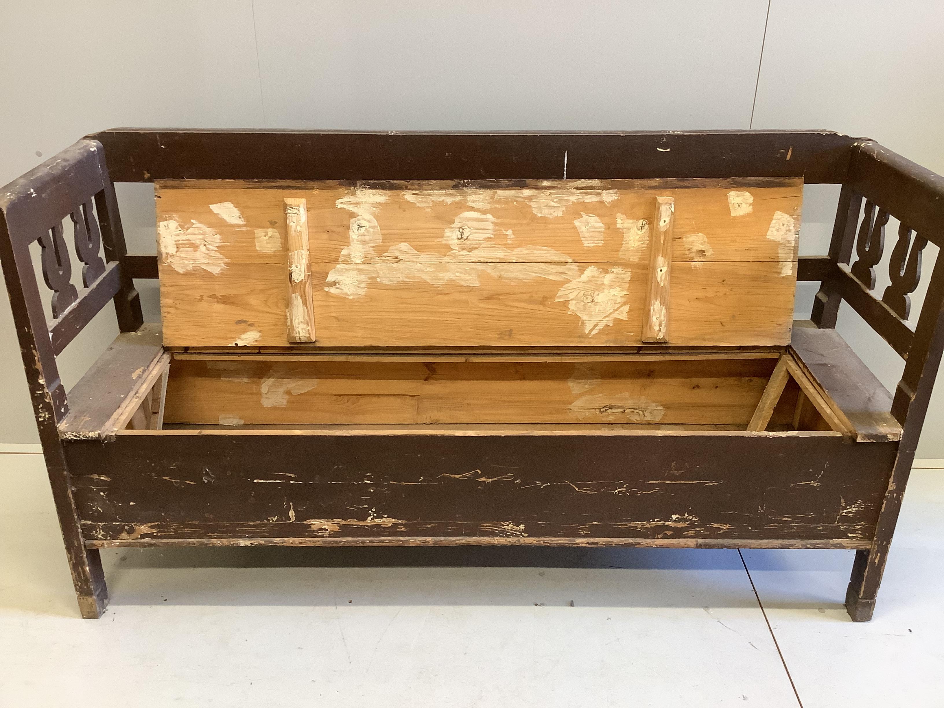 A 19th century Continental painted pine box seat settle, width 186cm, depth 52cm, height 98cm